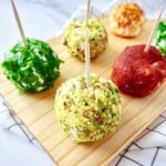 herbed ricotta balls on a wooden board.