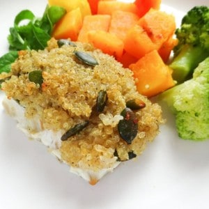 honey quinoa crusted cod on a white plate with broccoli and squash.