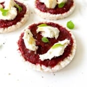 three beetroot and mozzarella topped rice cakes.