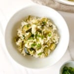 baked asparagus risotto in a white bowl.