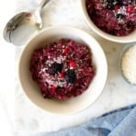 blackberry quinoa breakfast bake in two cream bowls.