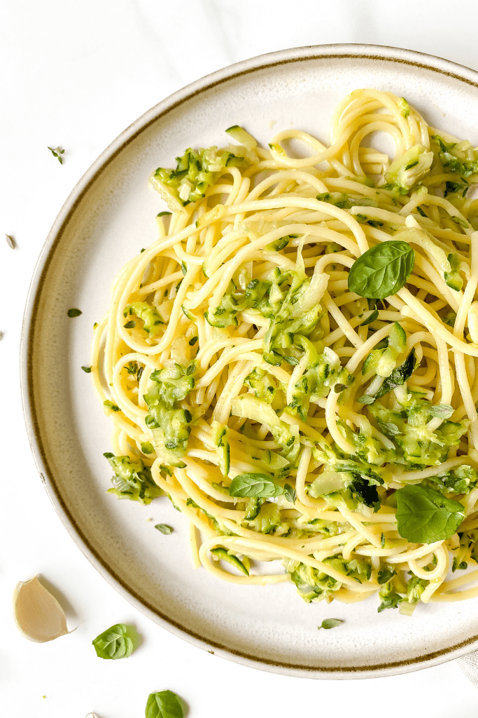 brown butter zucchini pasta on a brown plate