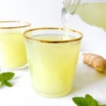 ginger beer being poured into a glass.