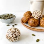 turmeric energy balls with a jug in the background.