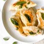 white plate of brown butter and sage chicken.