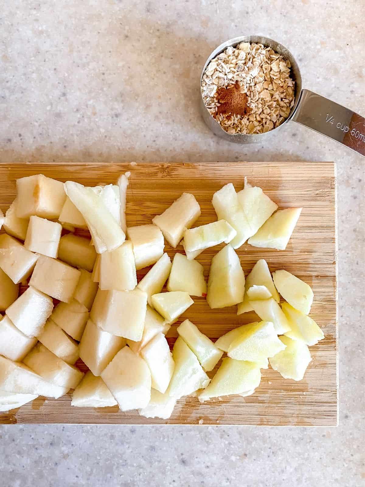 chopped apple and pear on a chopping board