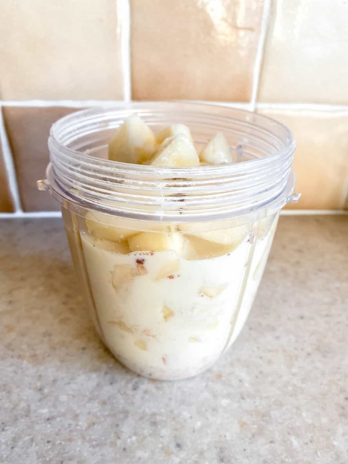 apple pear and milk in a blender