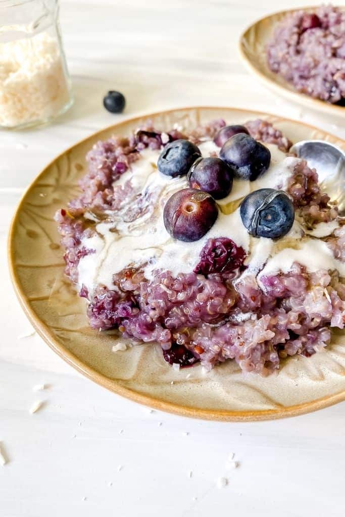 blueberry quinoa breakfast bake on a brown plate.