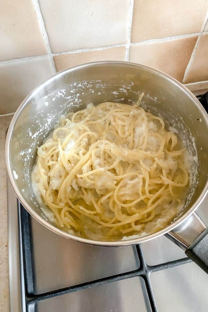 cauliflower pasta sauce in a pot on a stove top.