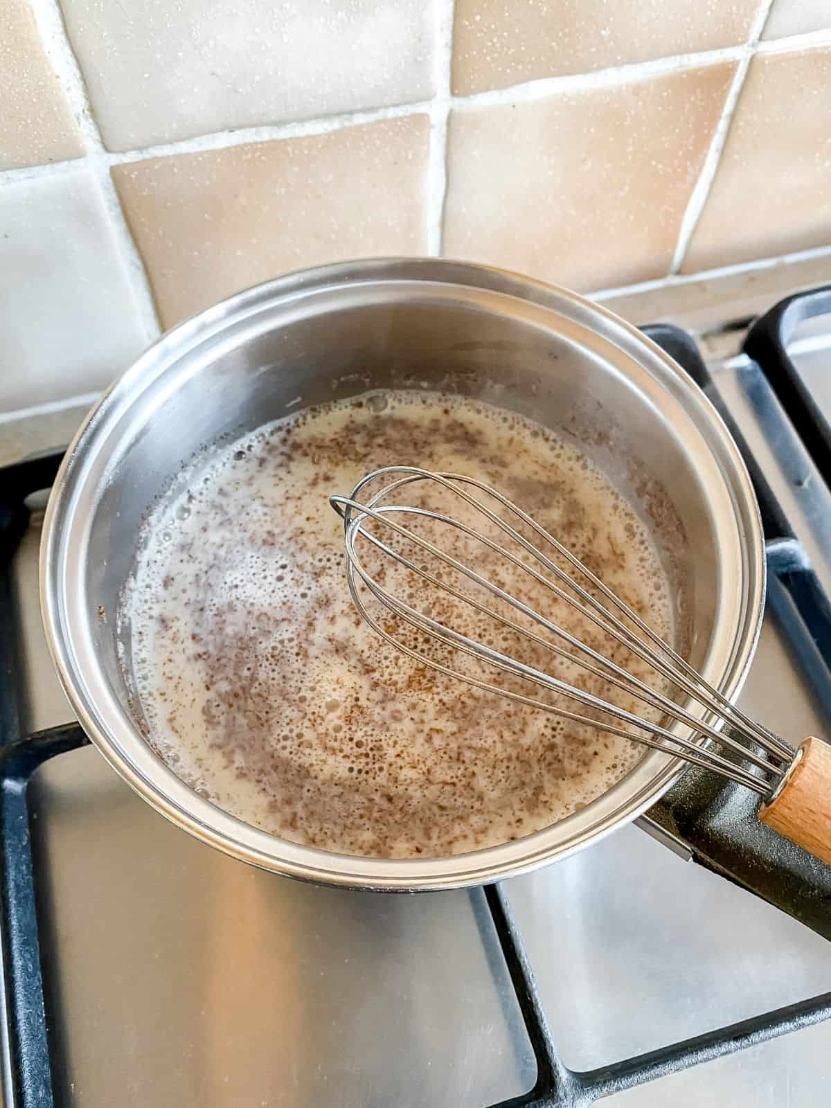 milk, turmeric, honey and ginger in a saucepan.