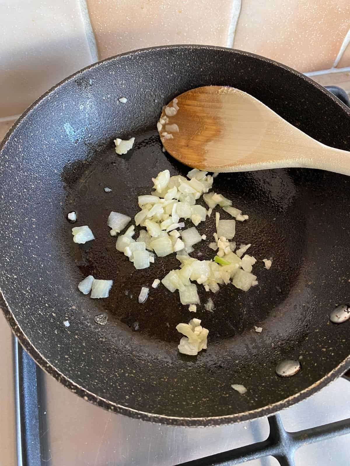 onion and garlic in a pan