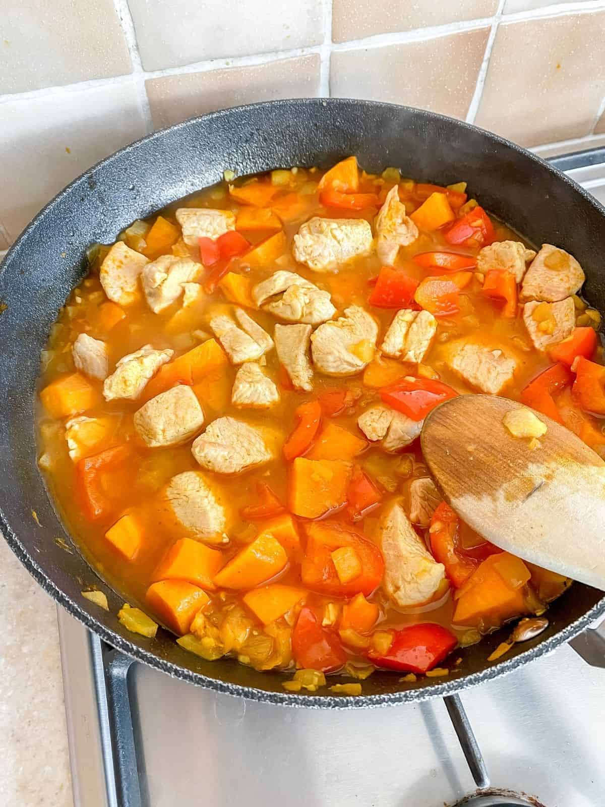 turkey and vegetables in a pan