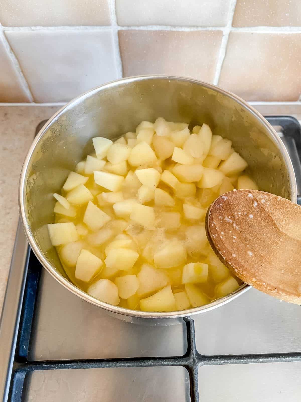 cooked apple and pear in a pan.