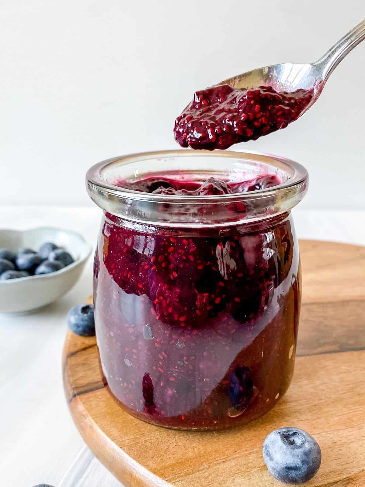 blueberry chia jam in a glass jar.
