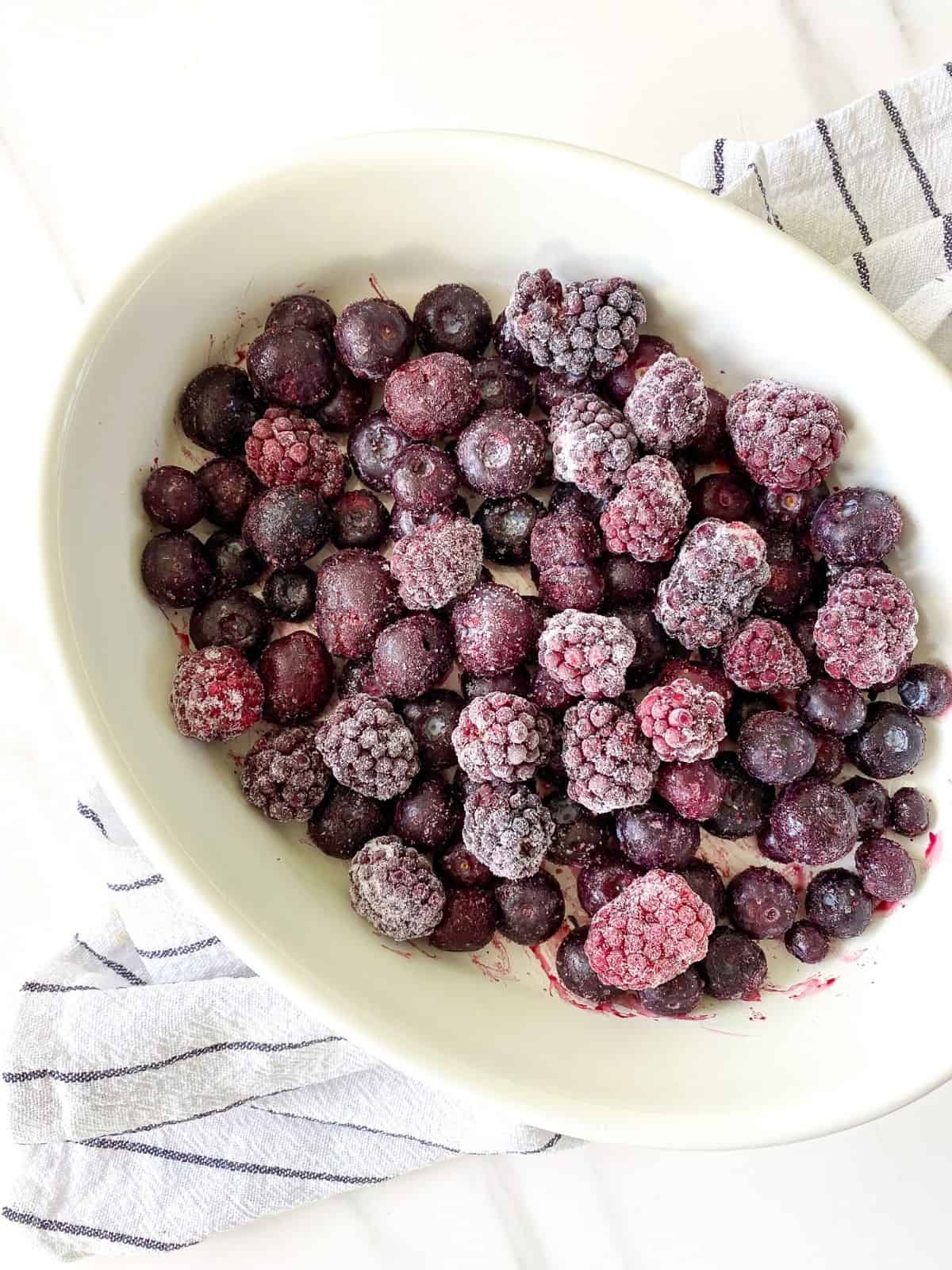 frozen fruit in a white dish.