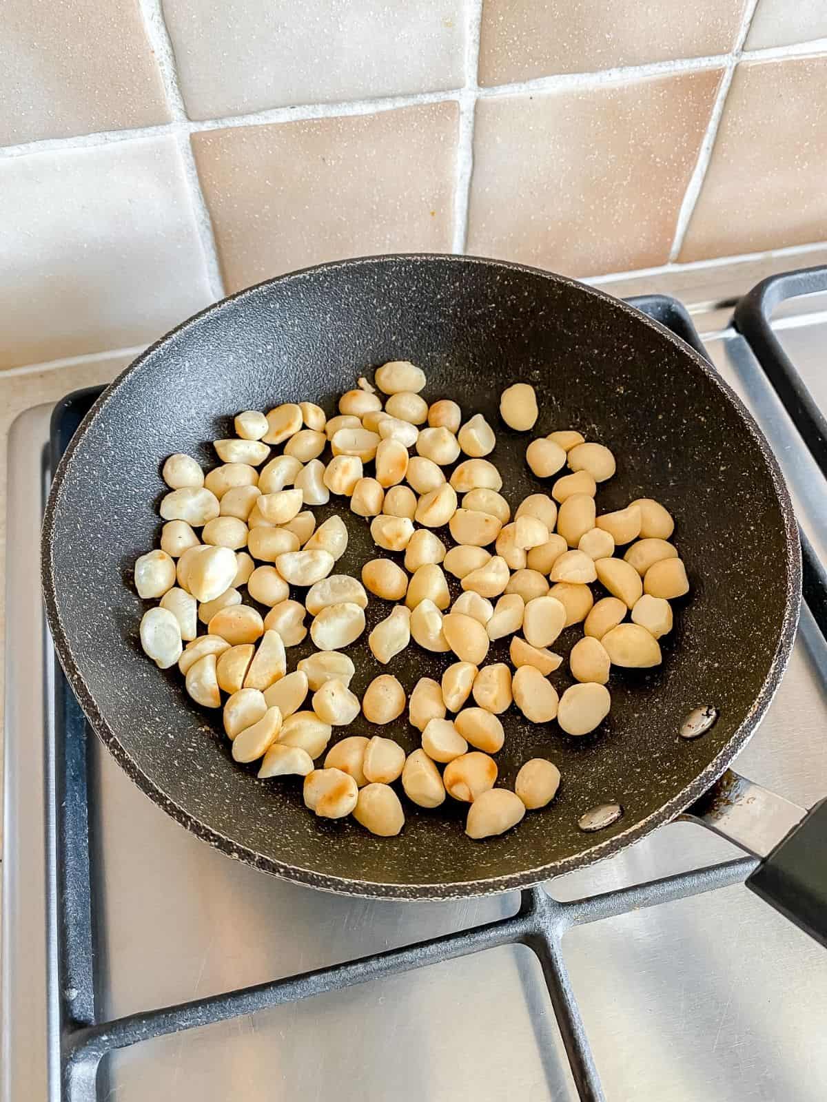 macadamia nuts in a pan.