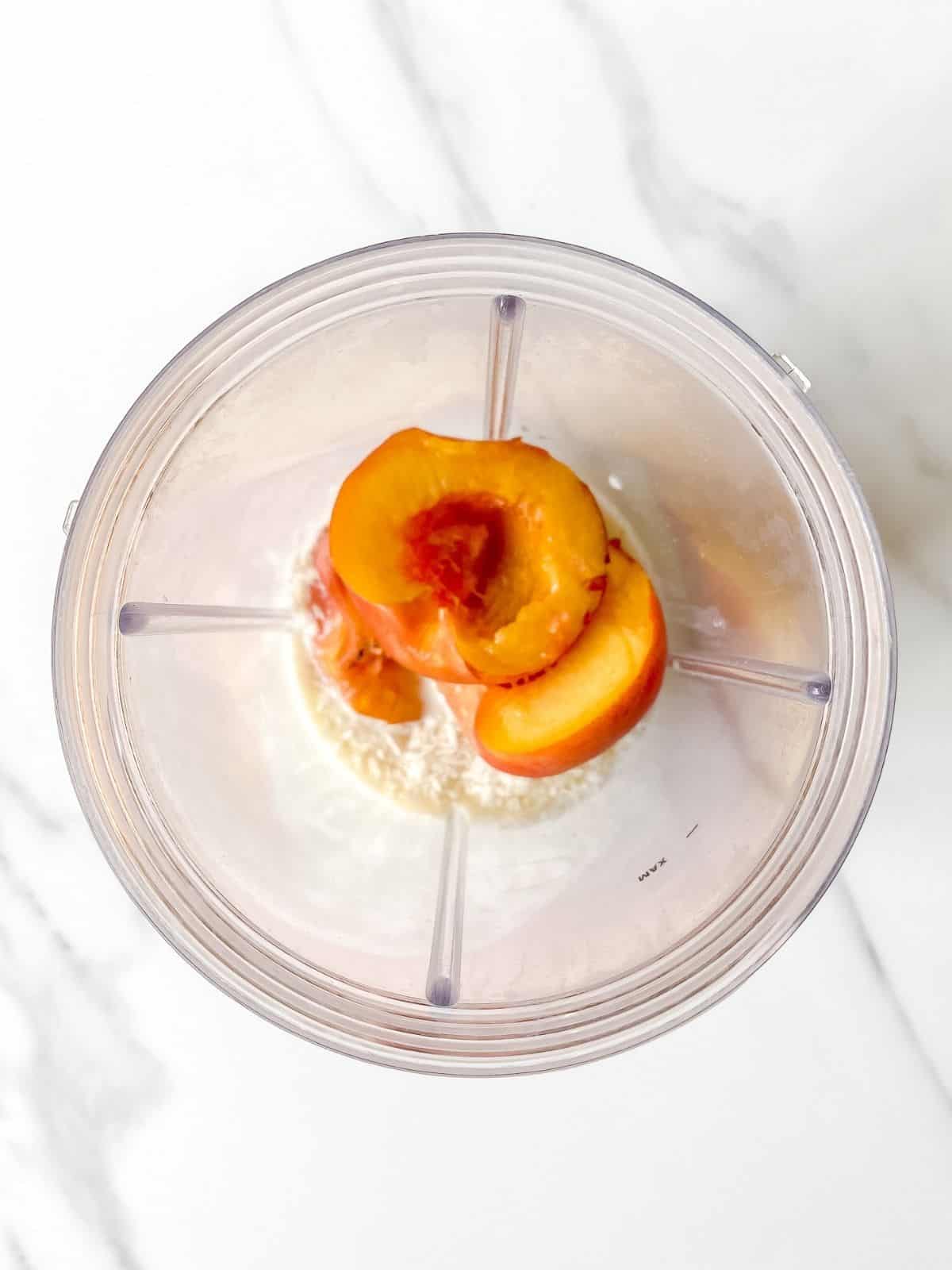 peaches in a blender cup.
