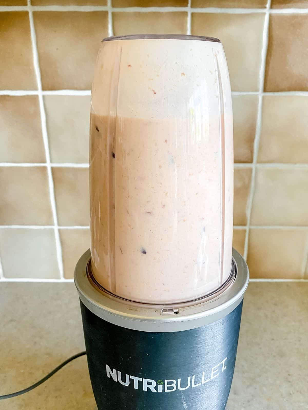 blended peaches and coconut milk in a blender.