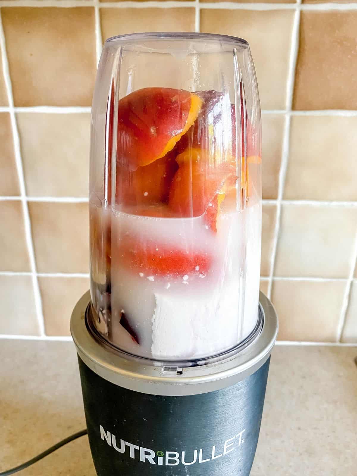 peaches and coconut milk in a Nutri-Bullet.
