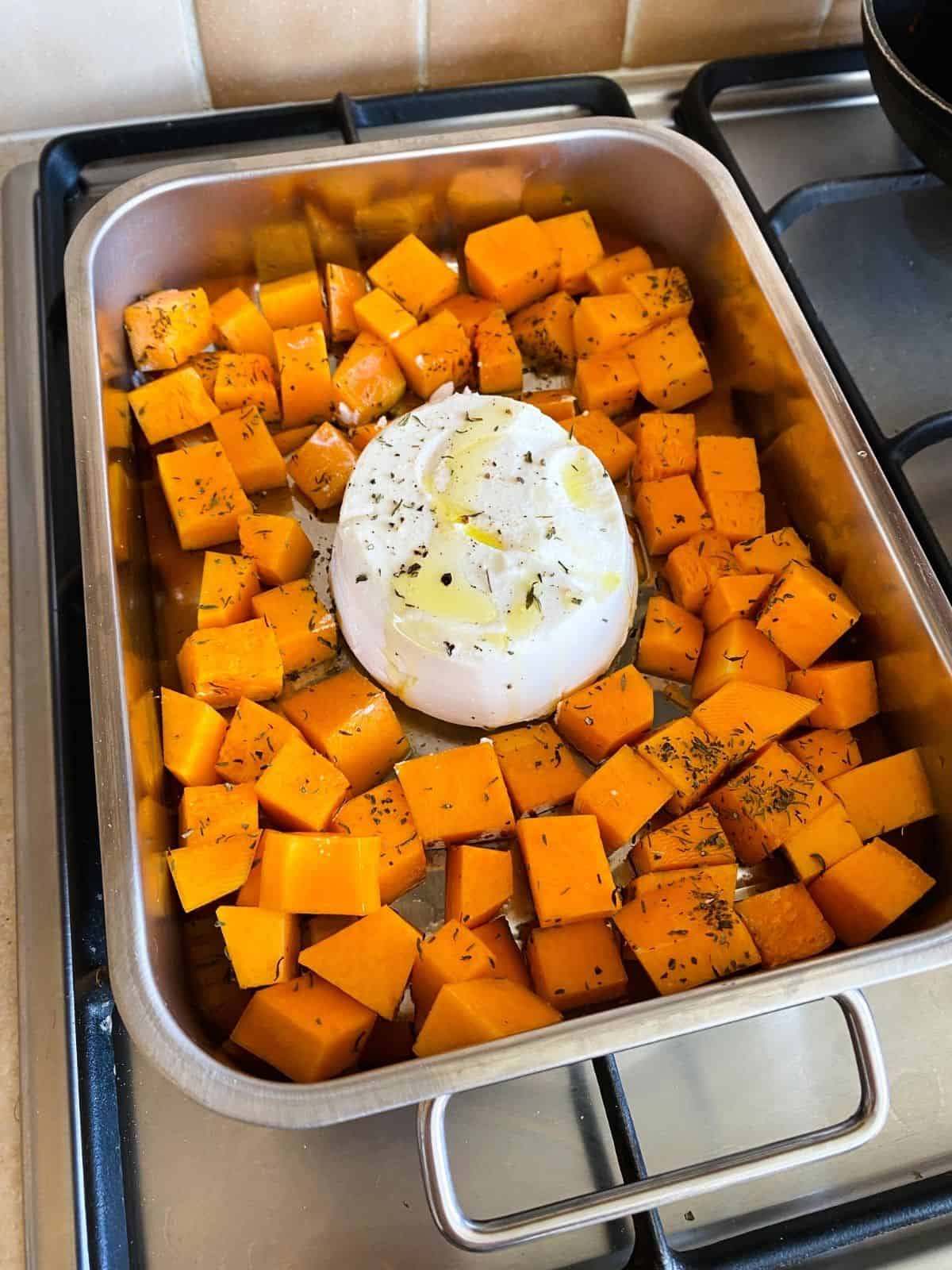 ricotta and butternut squash in a baking tray.