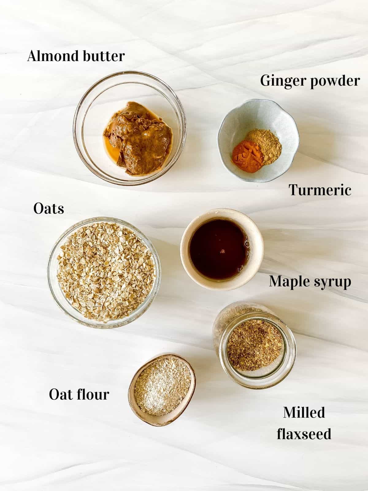 all the ingredients for turmeric cookies in small bowls.