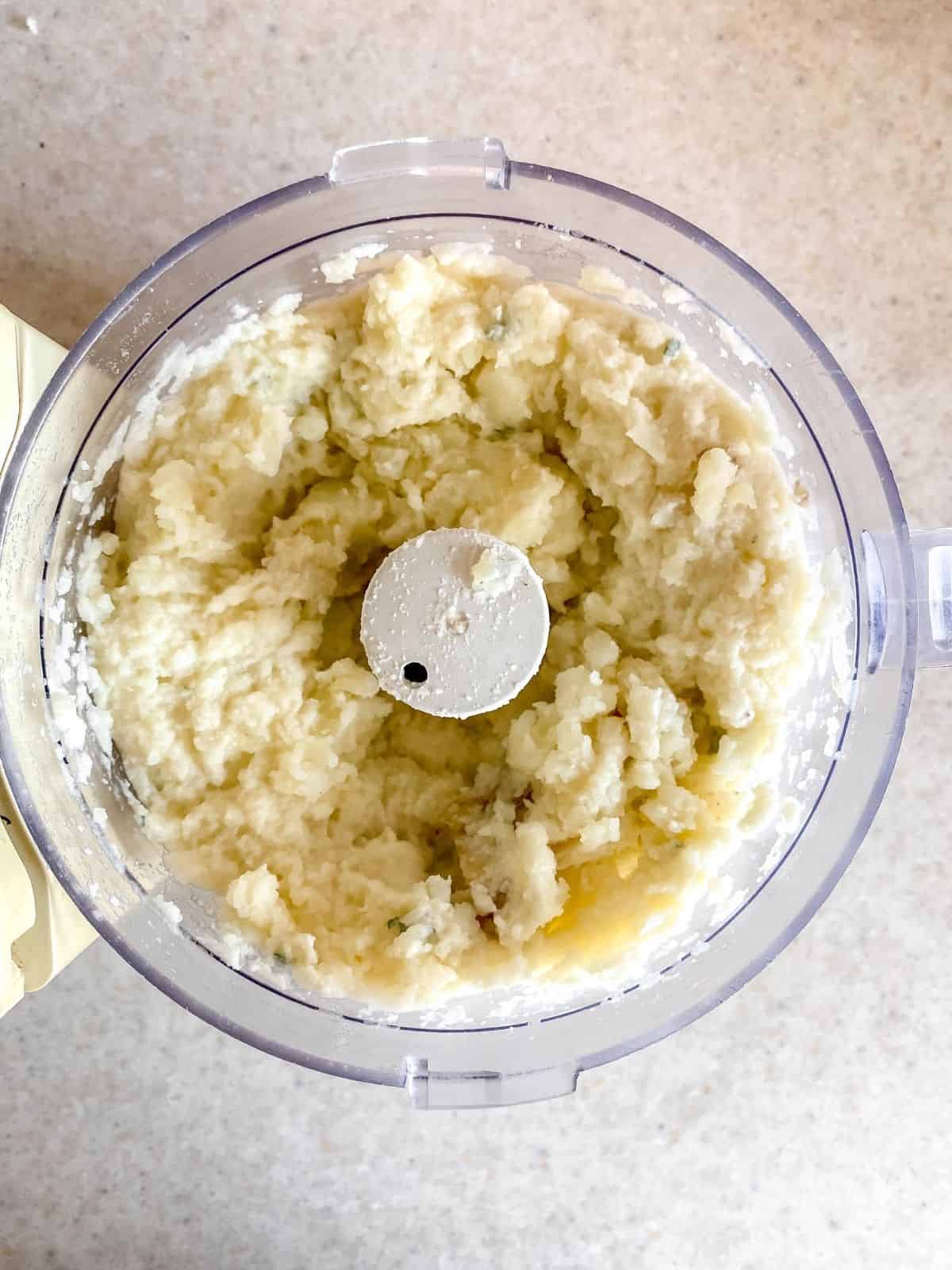 potato and cauliflower mash in a food processor.