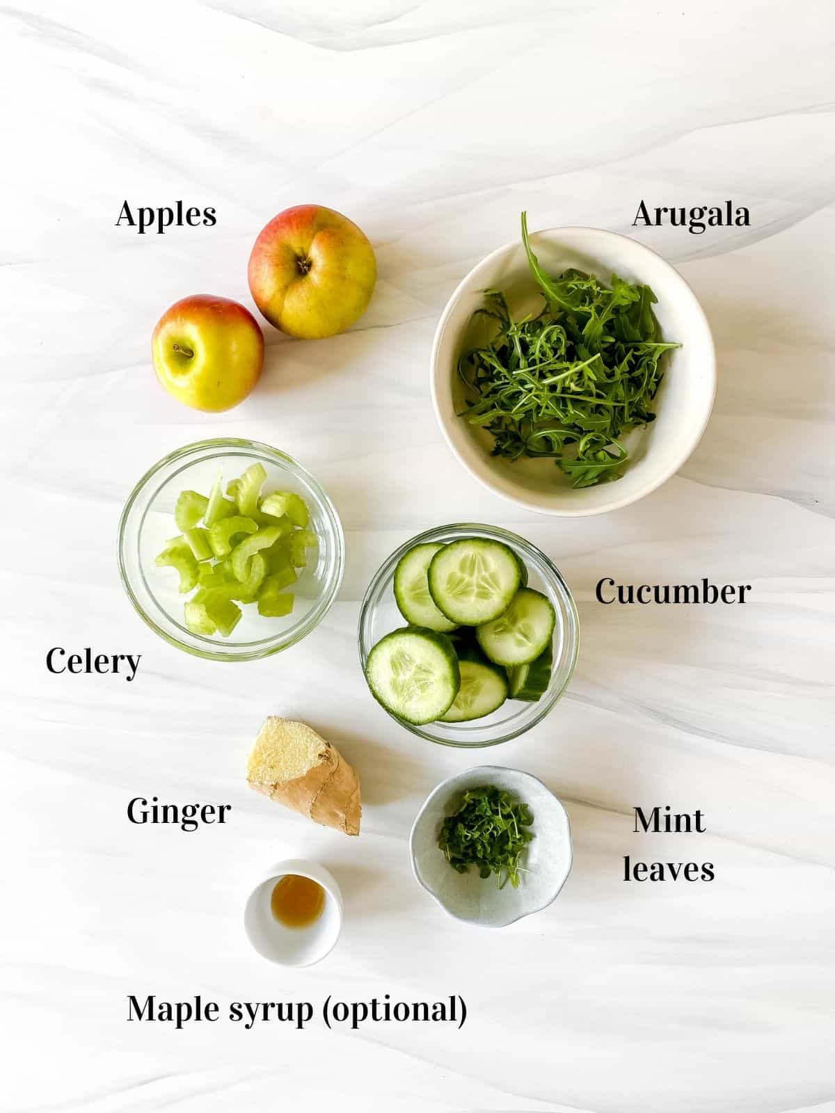 all the ingredients to make low histamine green juice in small bowls.