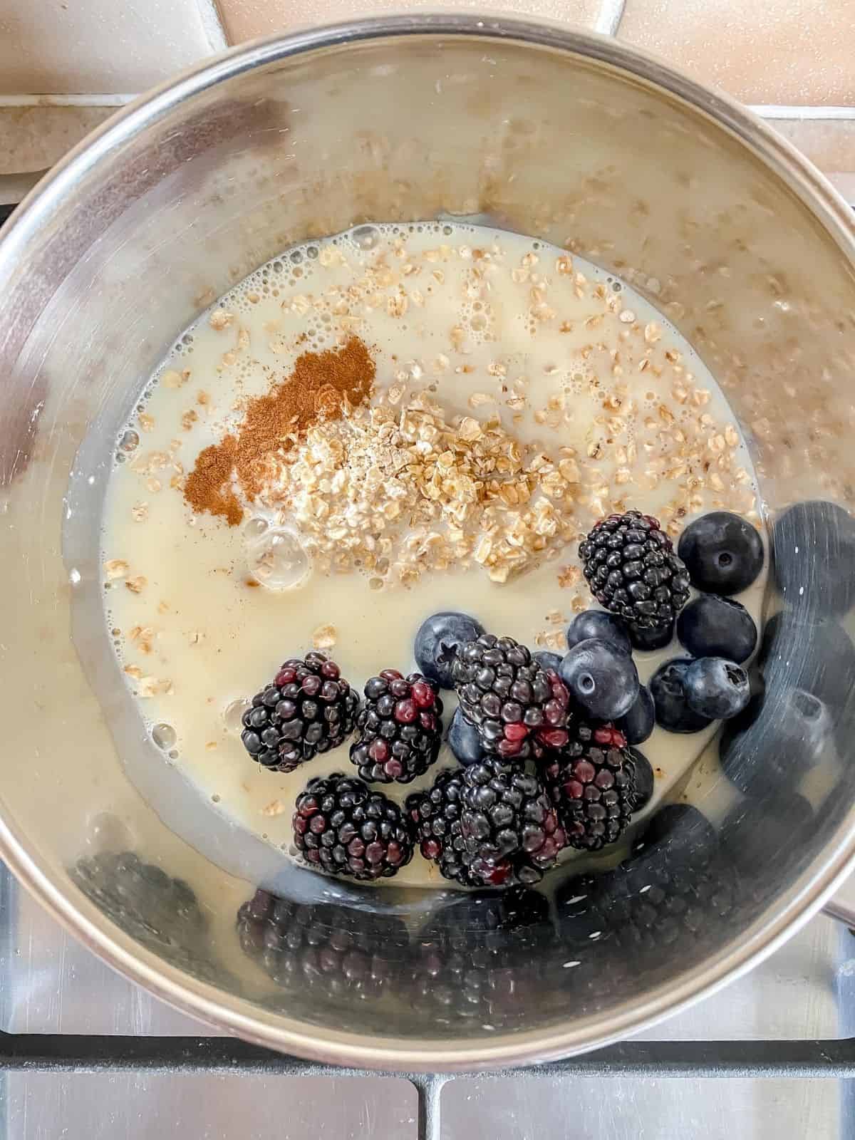 berries, oats and cinnamon in a saucepan.