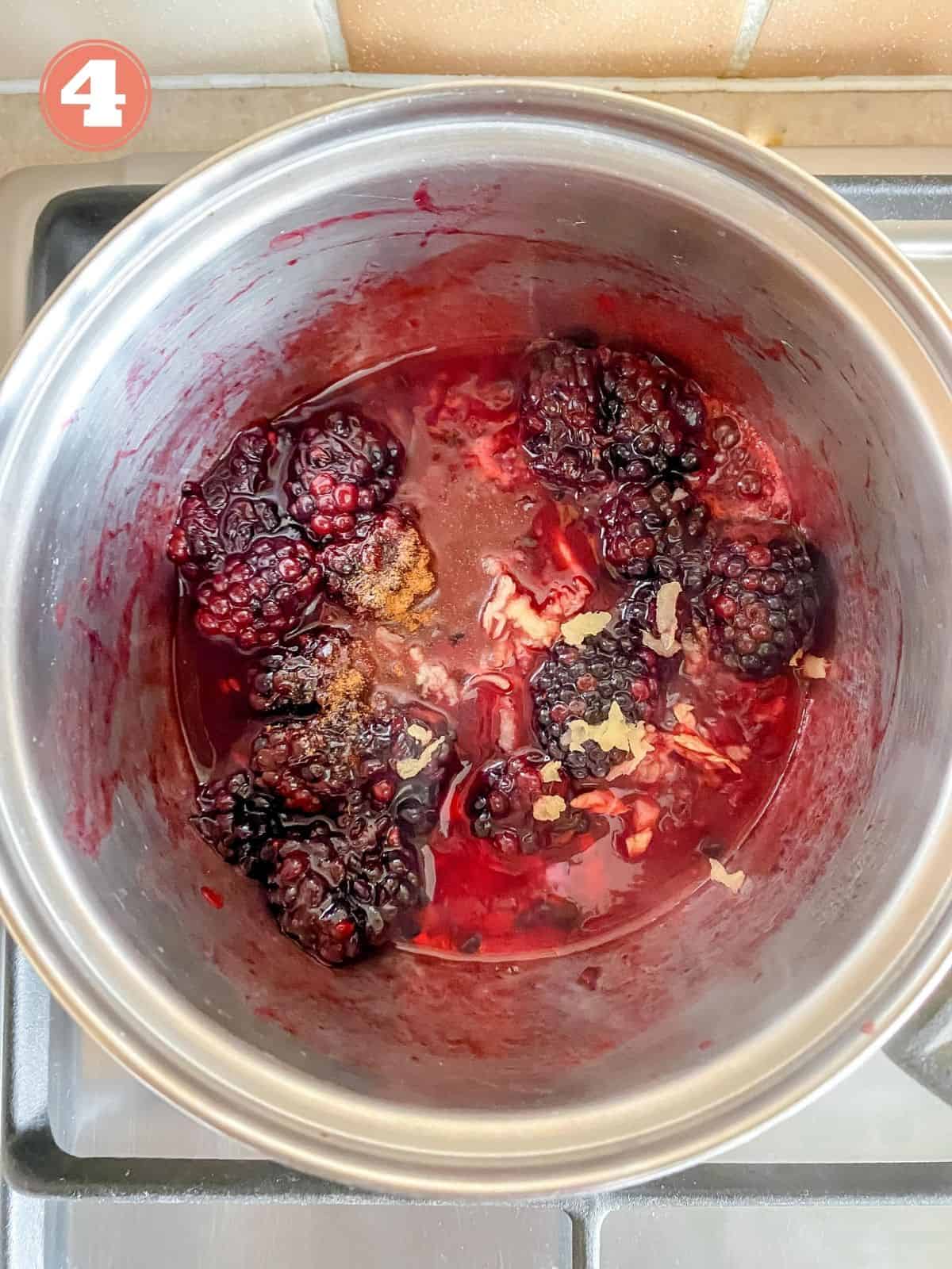 blackberries, ginger and maple syrup in a saucepan.