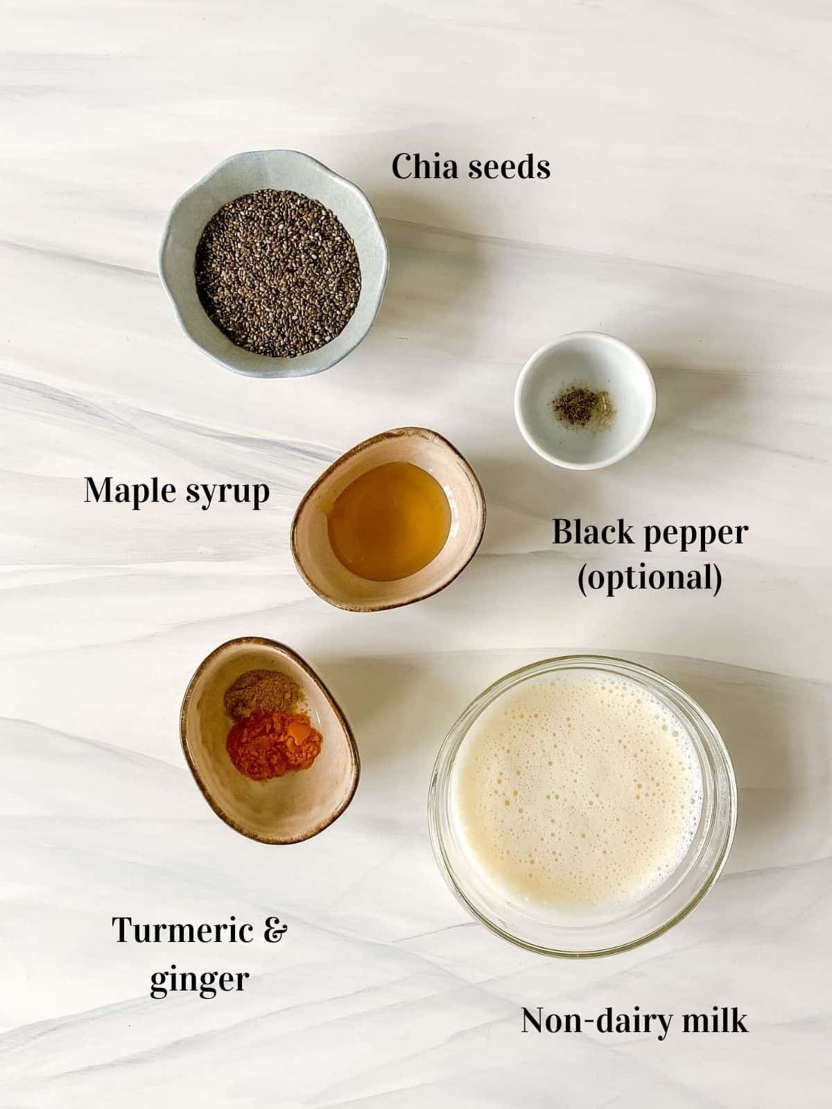 all the ingredients to make golden milk chia pudding in small bowls.