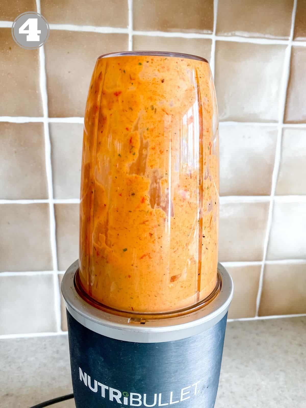 red pepper sauce in a Nutribullet blender labelled number four.