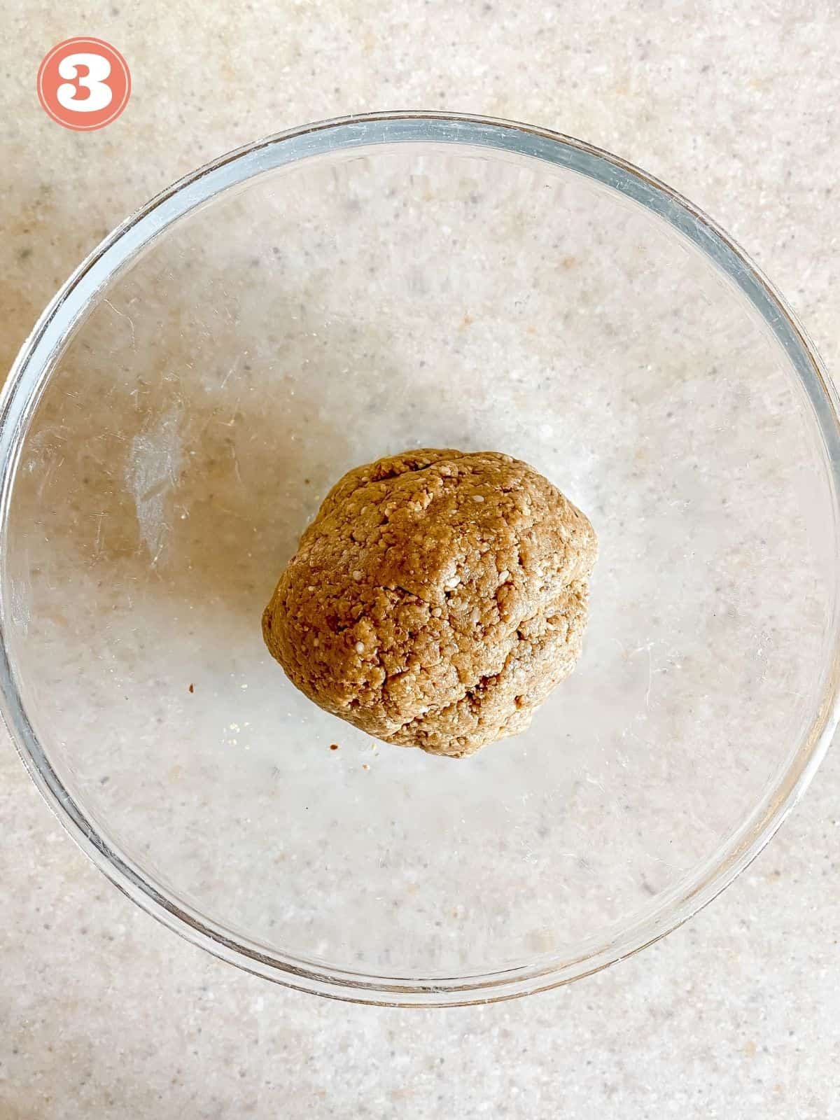 ball of energy ball dough in a glass bowl labelled number three.