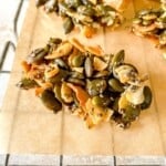 pumpkin seed clusters on a lined wire rack.