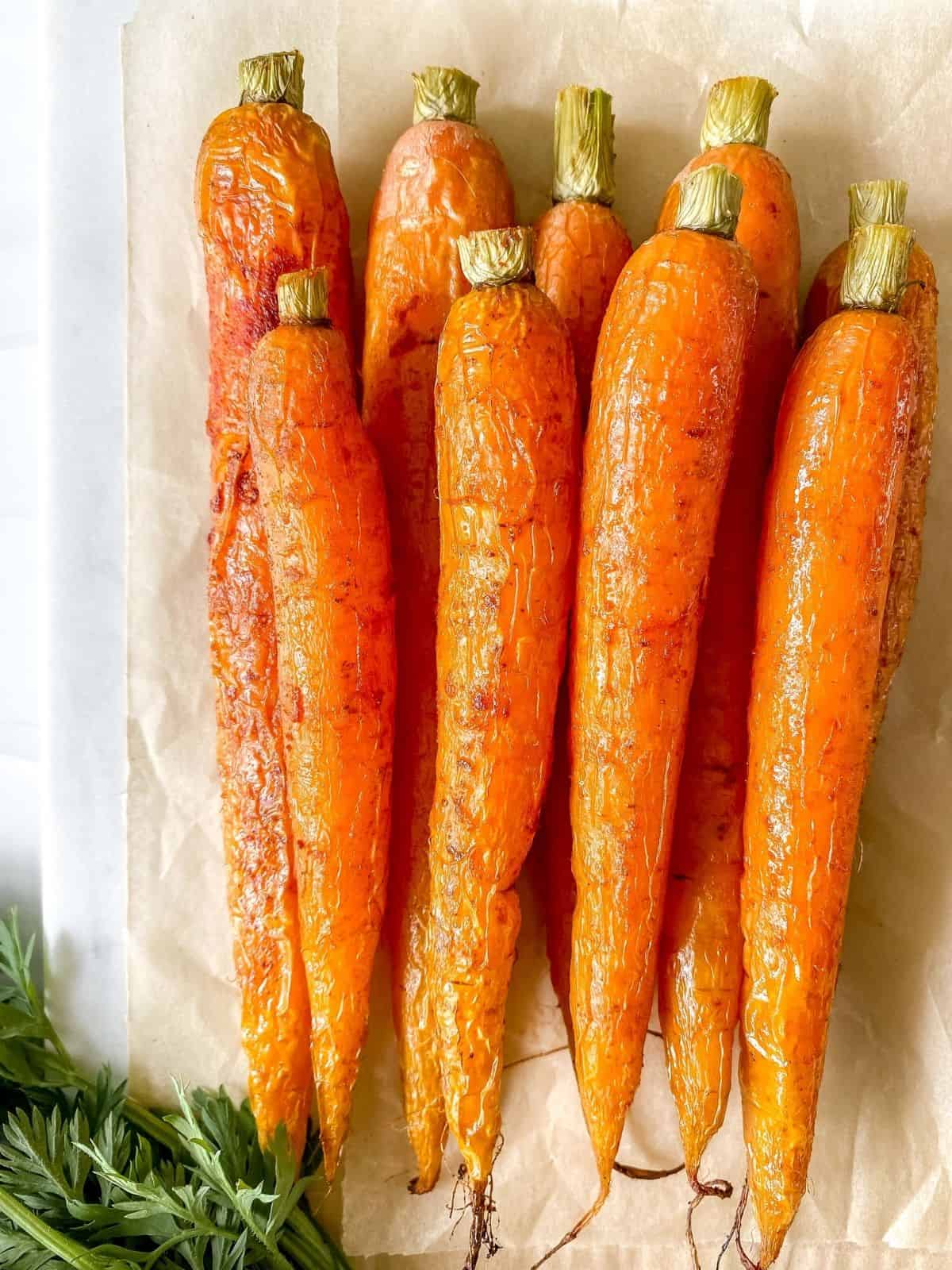 roasted carrots on parchment paper.