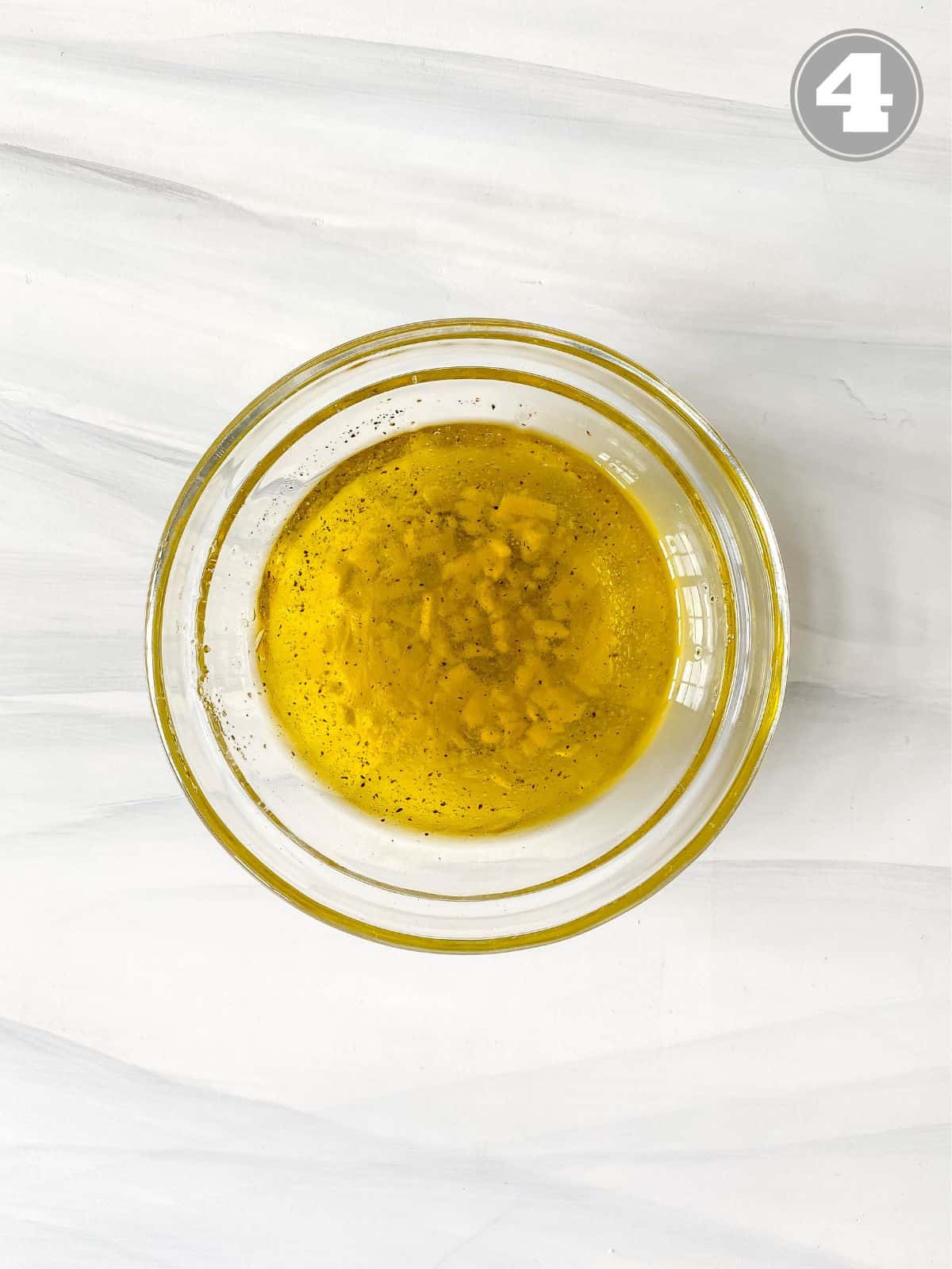 olive oil vinaigrette in a glass bowl.