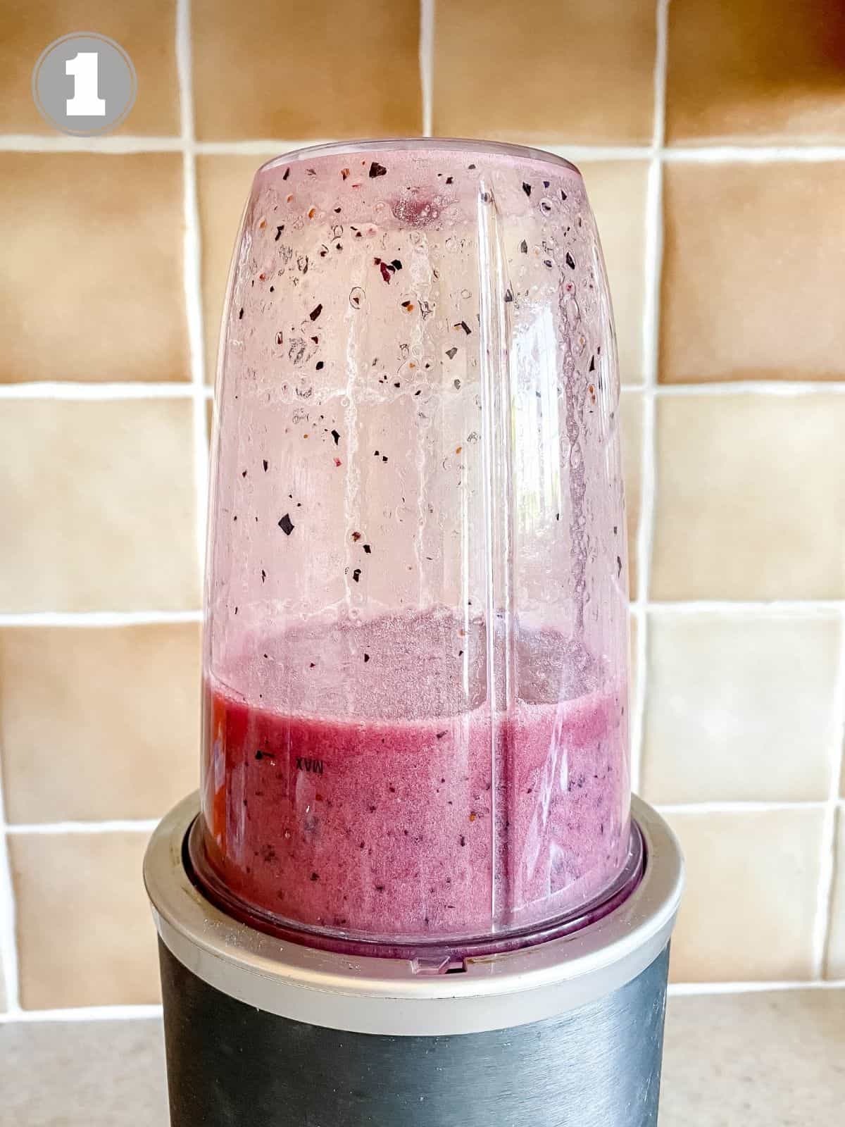 blueberry agua fresca in a blender with number one in the corner.
