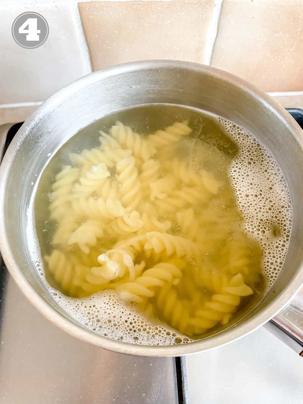 pasta being cooked in a pot.