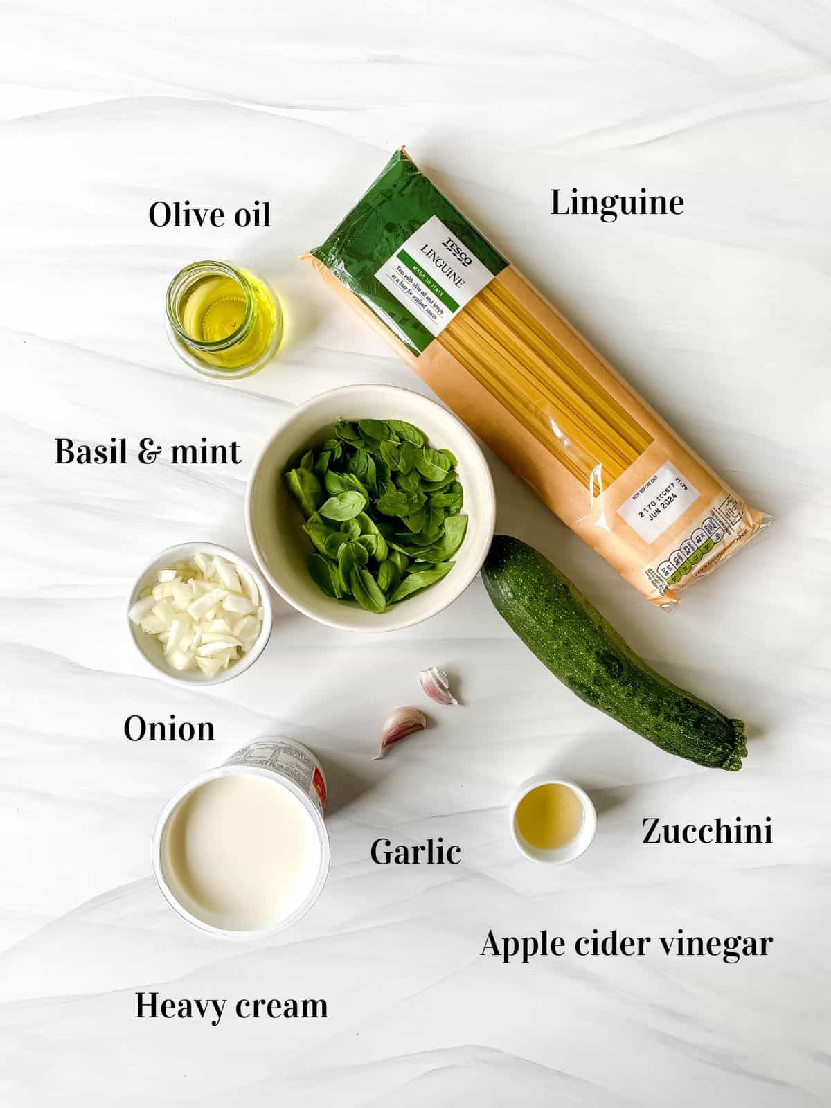 individually labelled ingredients to make zucchini linguine including heavy cream, garlic and herbs.