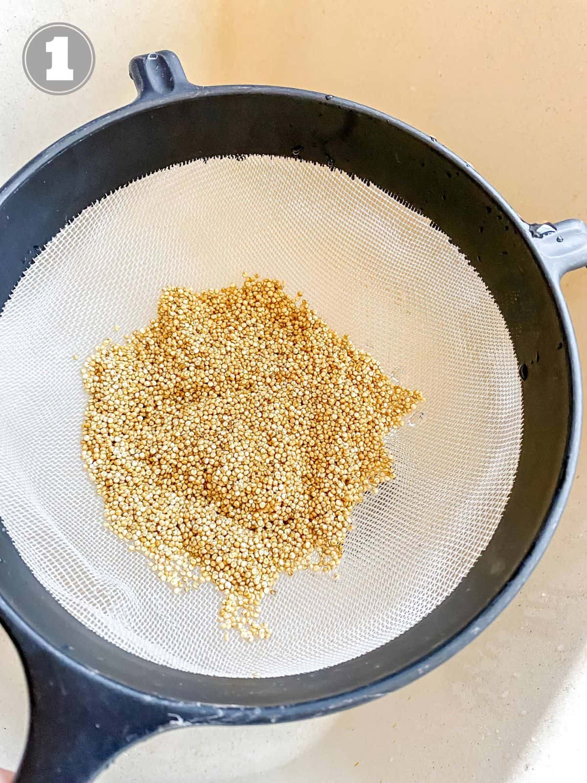 quinoa in a sieve labelled number one.