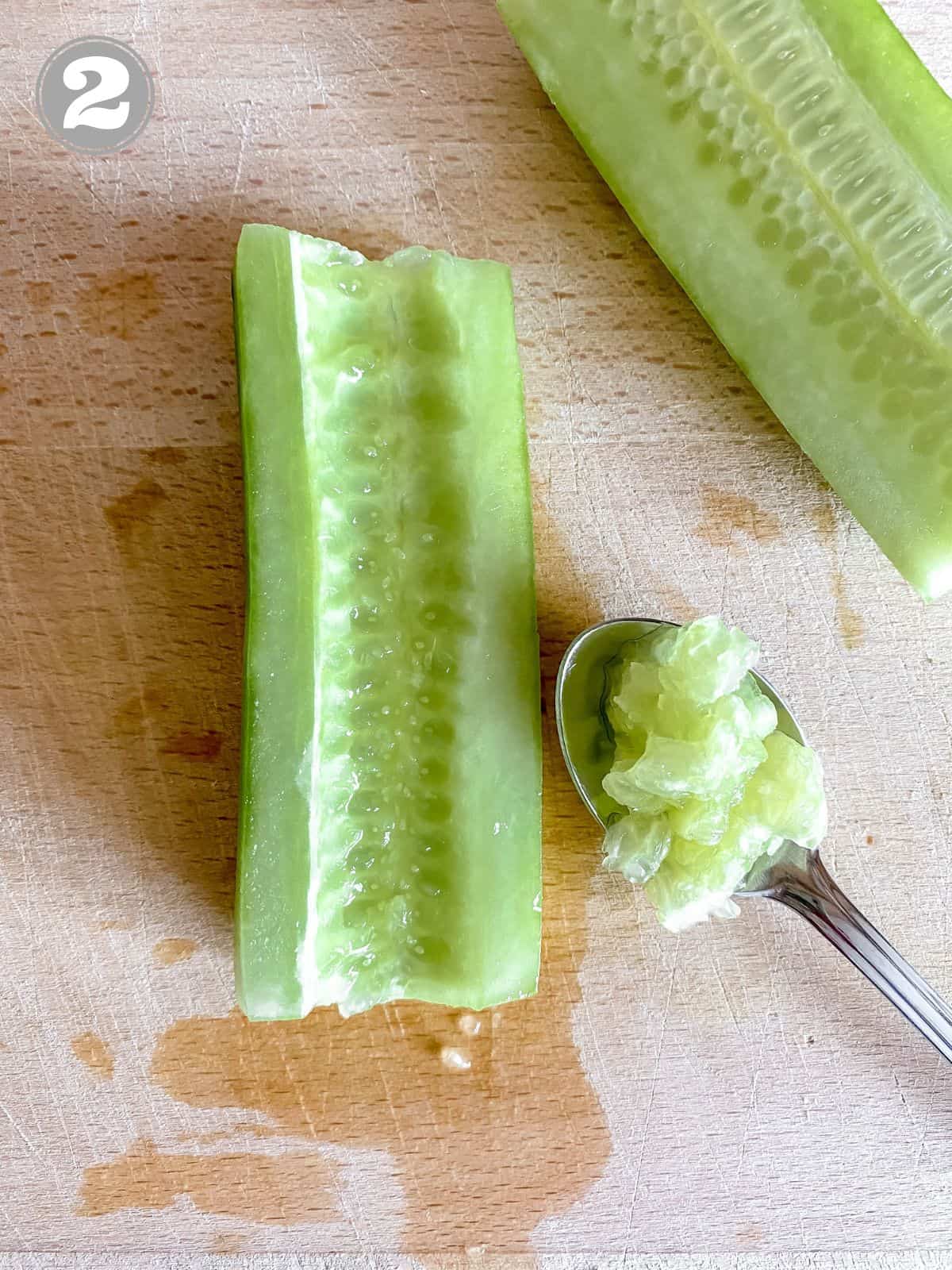 cucumber with seeds removed next to a spoonful of cucumber seeds labelled number two.