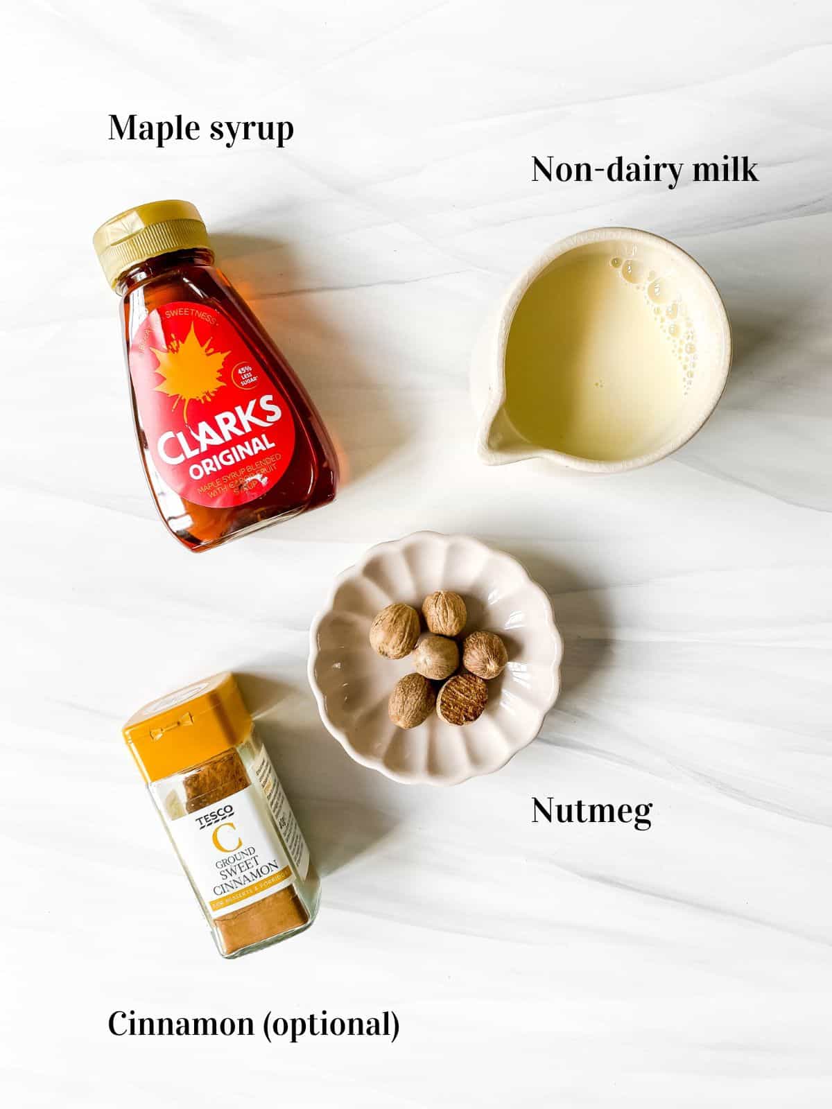 individually labelled ingredients to make nutmeg milk including maple syrup, nutmegs and cinnamon.