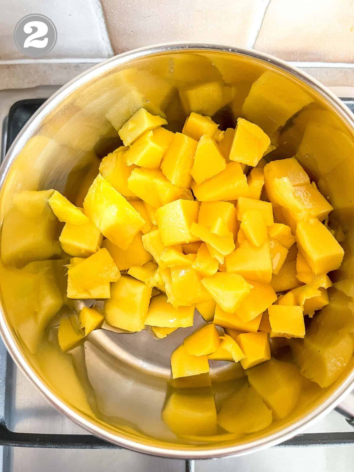 mango chunks in a large pot labelled number two.