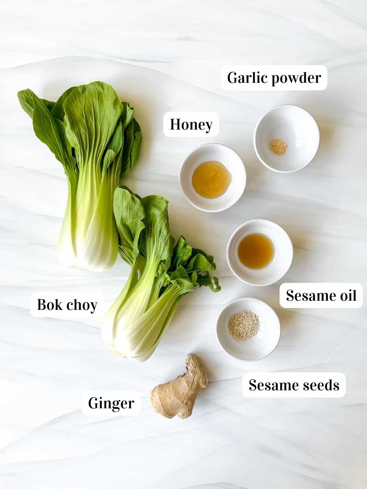 individually labelled ingredients to make air fryer bok choy including sesame oil, honey and ginger.