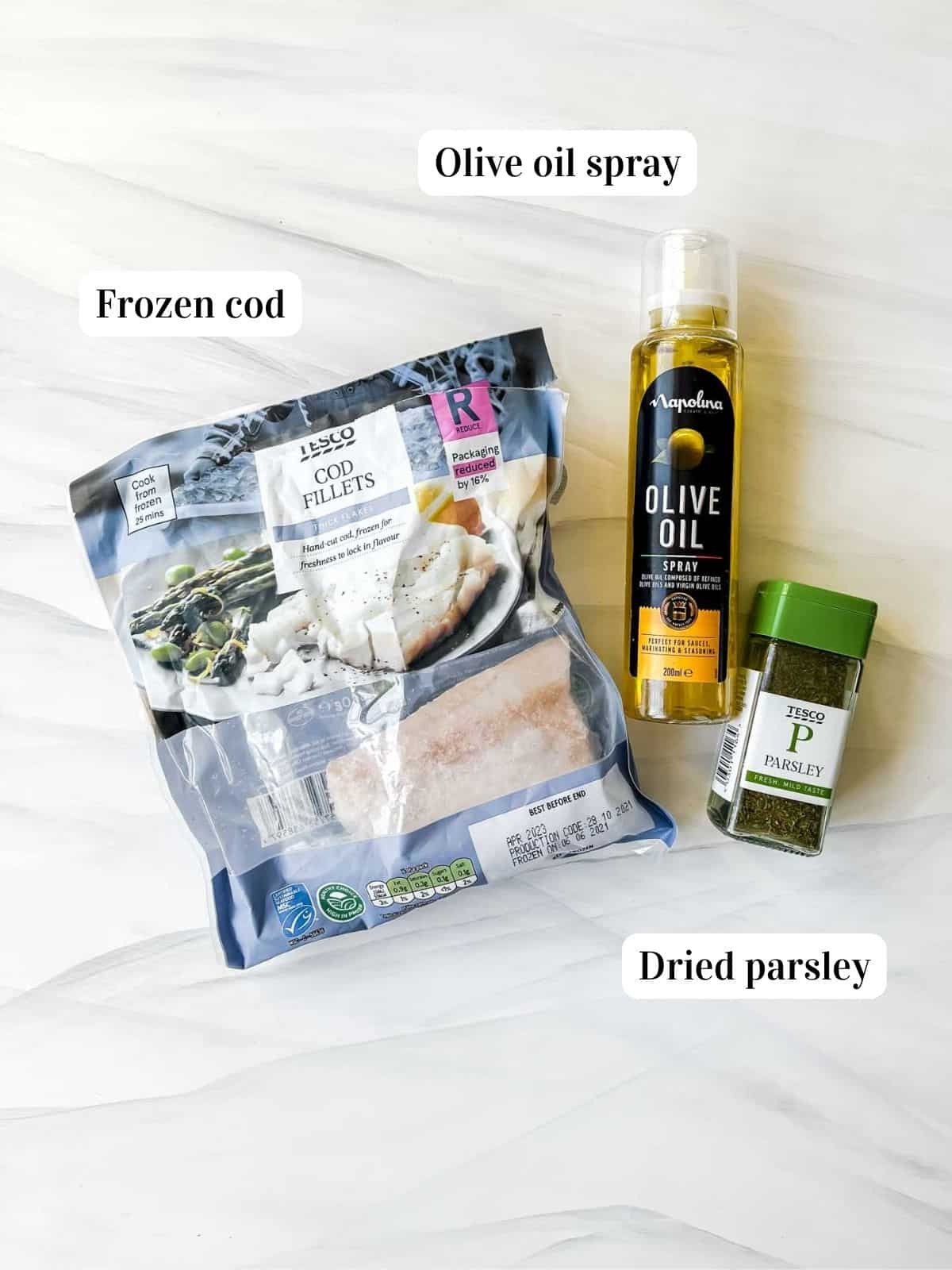 individually labelled ingredients to make air fryer frozen cod including olive oil and dried parsley.