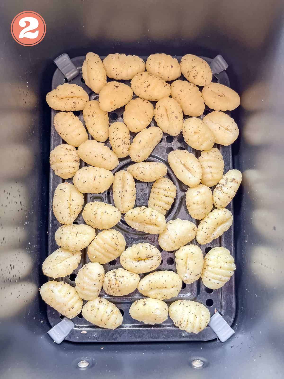 gnocchi in an air fryer basket labelled number two.
