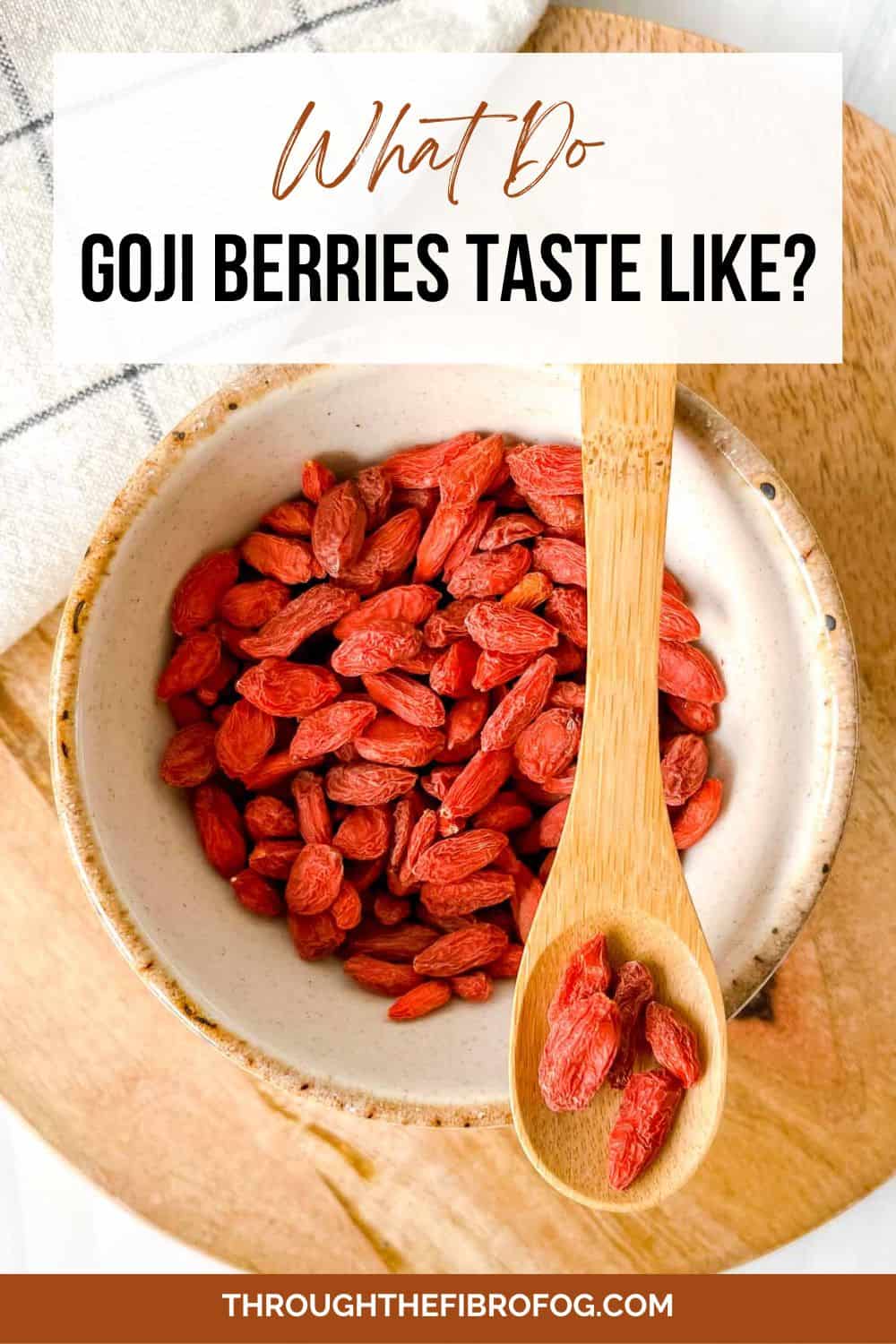 labelled what do goji berries taste like with a spoonful of berries above a cream bowl of goji berries.