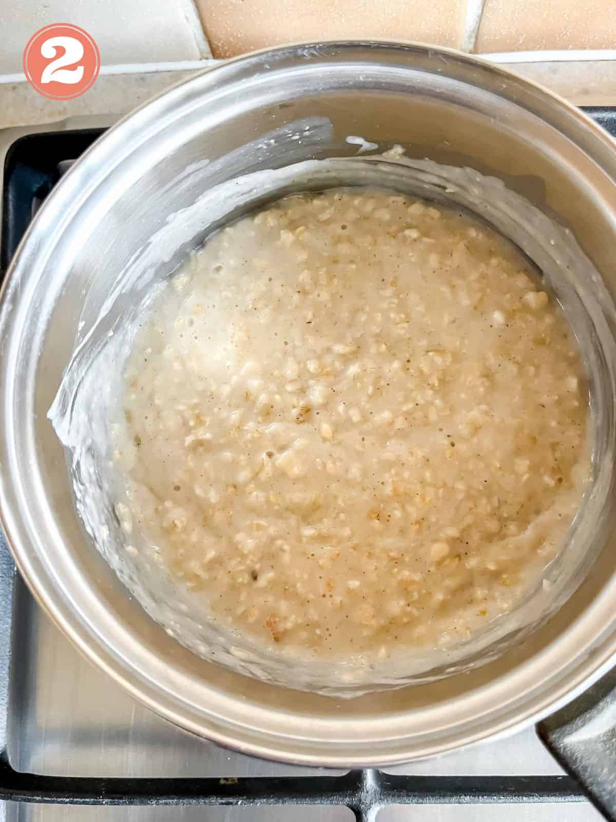porridge in a pot on a stove top labelled number two.