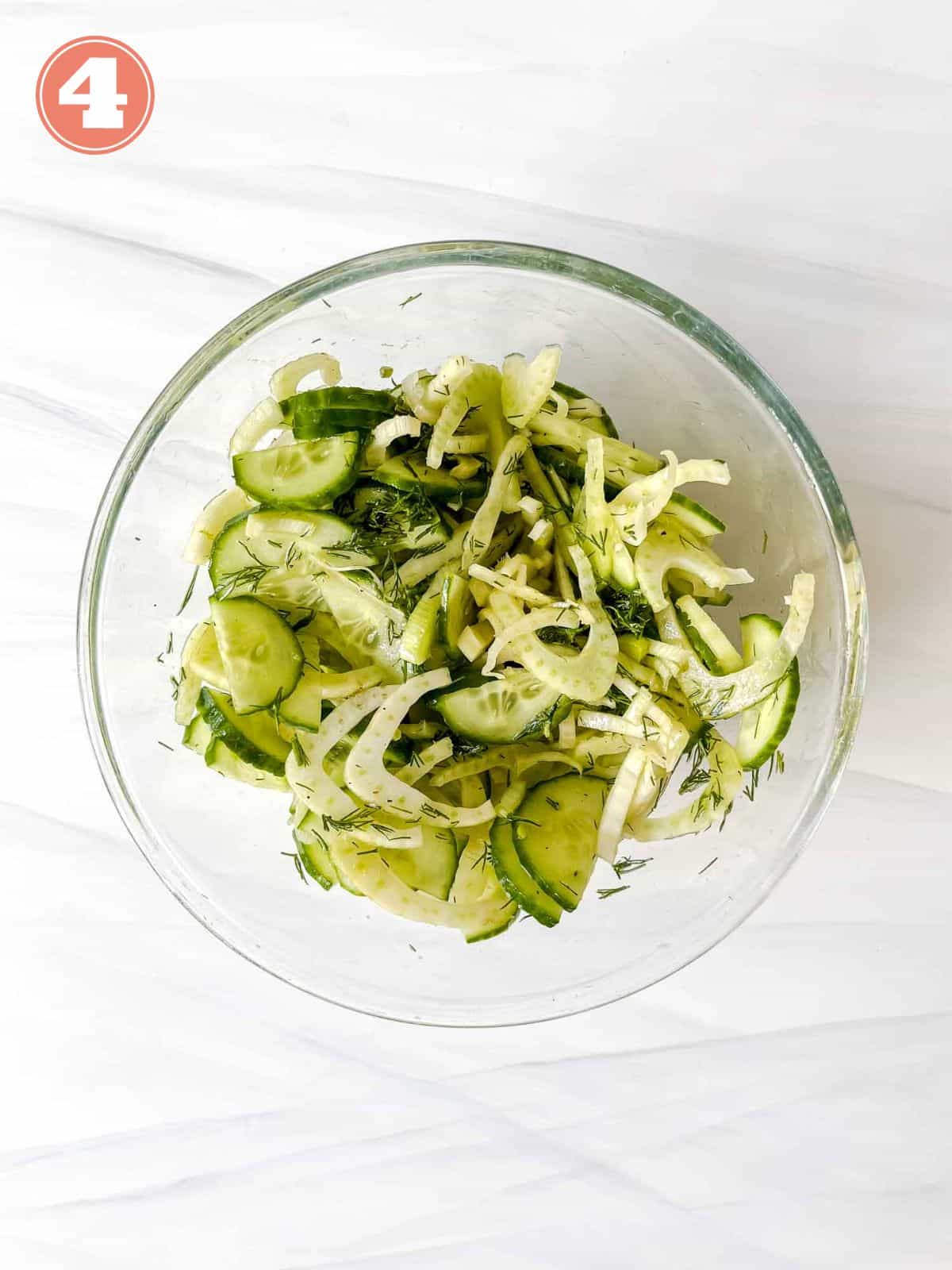 cucumber and fennel salad in a glass bowl labelled number four.