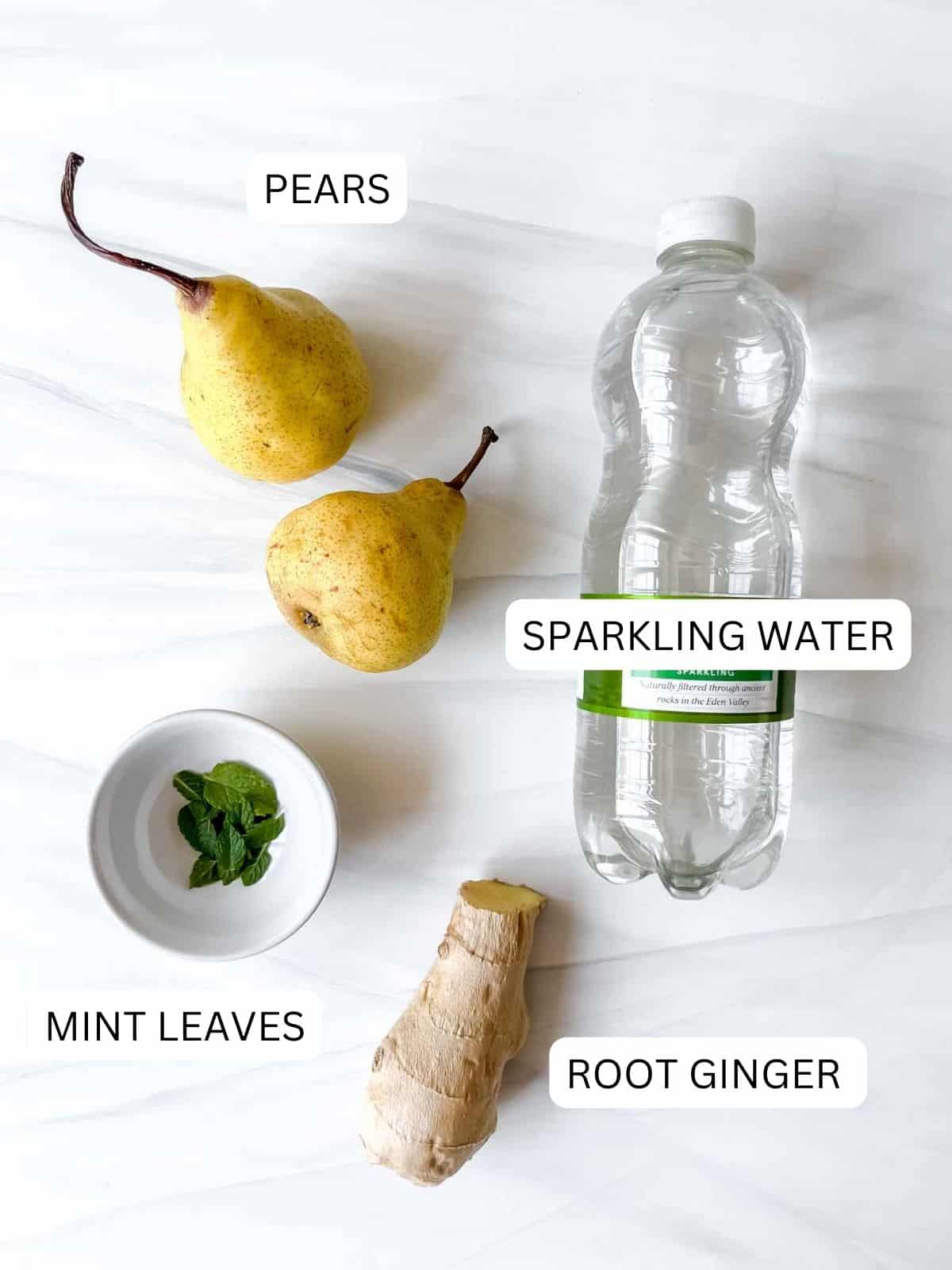 individually labelled sparkling water, pears, mint leaves and root ginger.