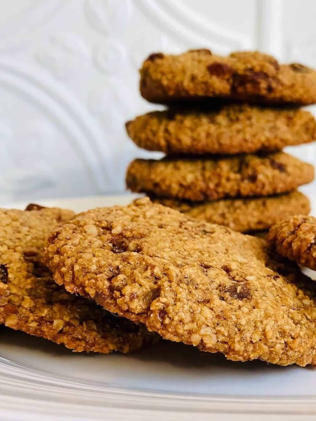 oat flour cookies in a stack on a white plate.